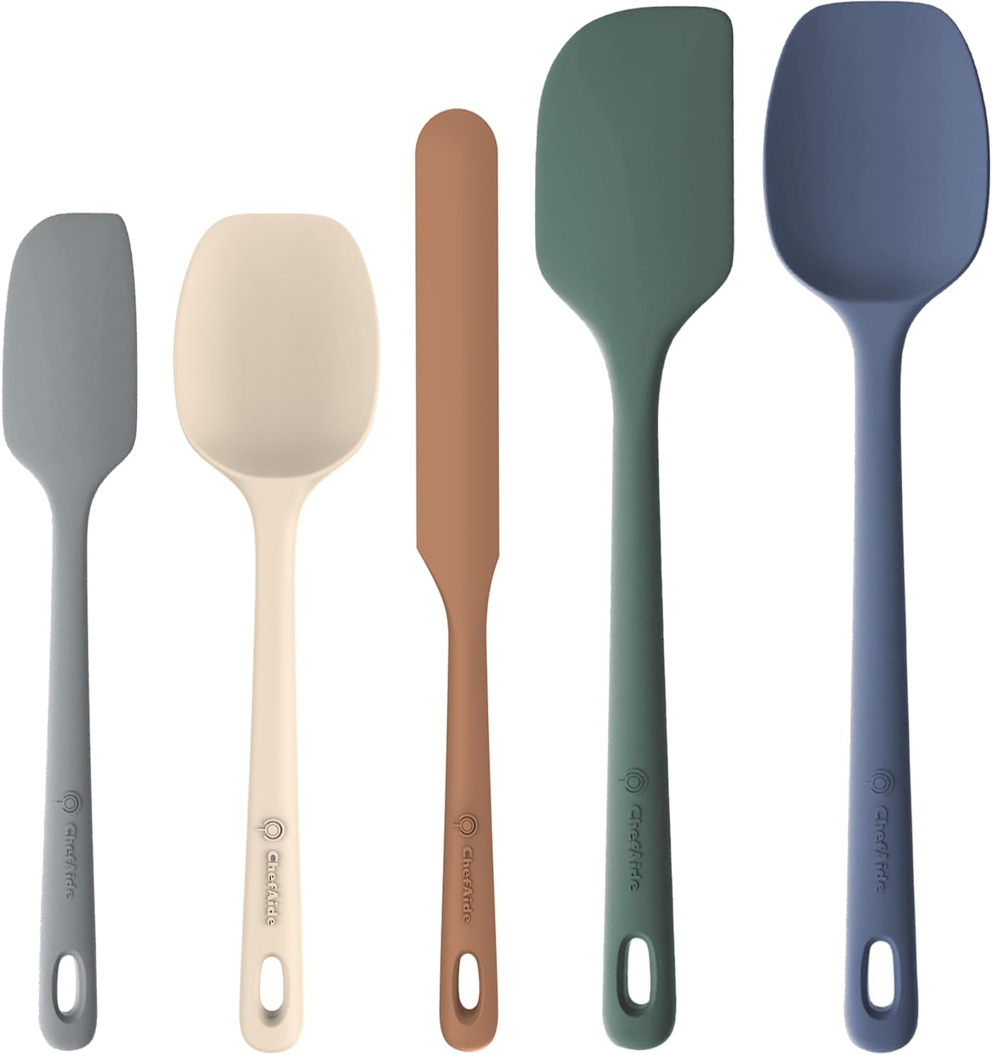Set of five silicone spatulas in different colors on a white background